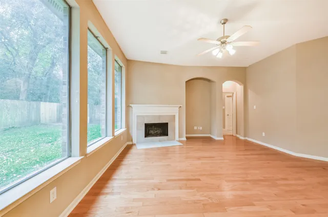 a view of an empty room with glass door
