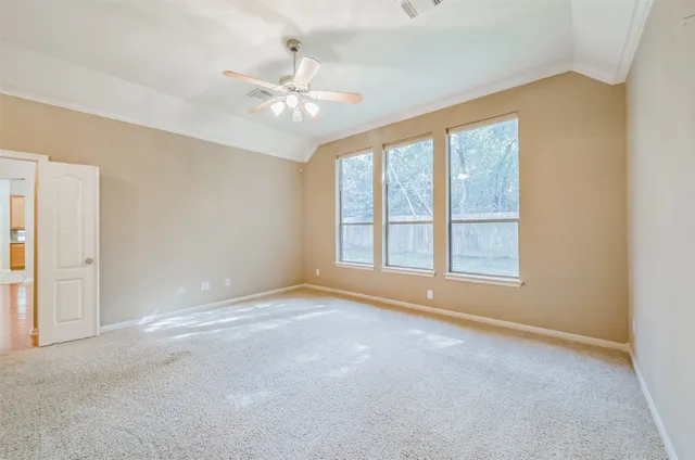 a view of an empty room with a window