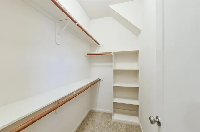 a view of an empty walk in closet