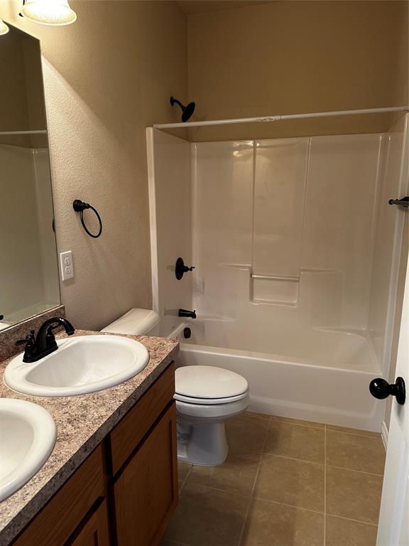 1908 Elizabeth Street Sherman, TX 75090 - Photo 11 of 17 a bathroom with a granite countertop sink toilet and shower