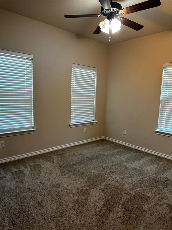 1908 Elizabeth Street Sherman, TX 75090 - Photo 12 of 17 a view of an empty room with a window