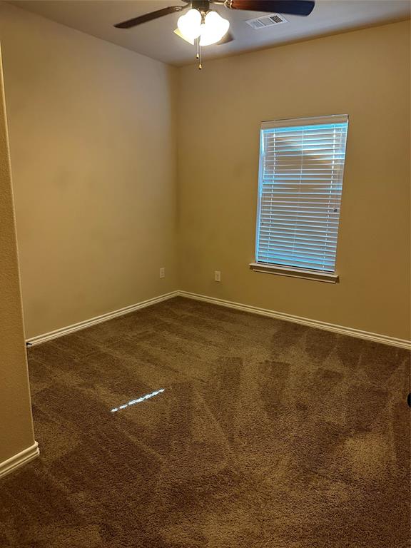 1908 Elizabeth Street Sherman, TX 75090 - Photo 9 of 17 a view of an empty room with a chandeliers fan