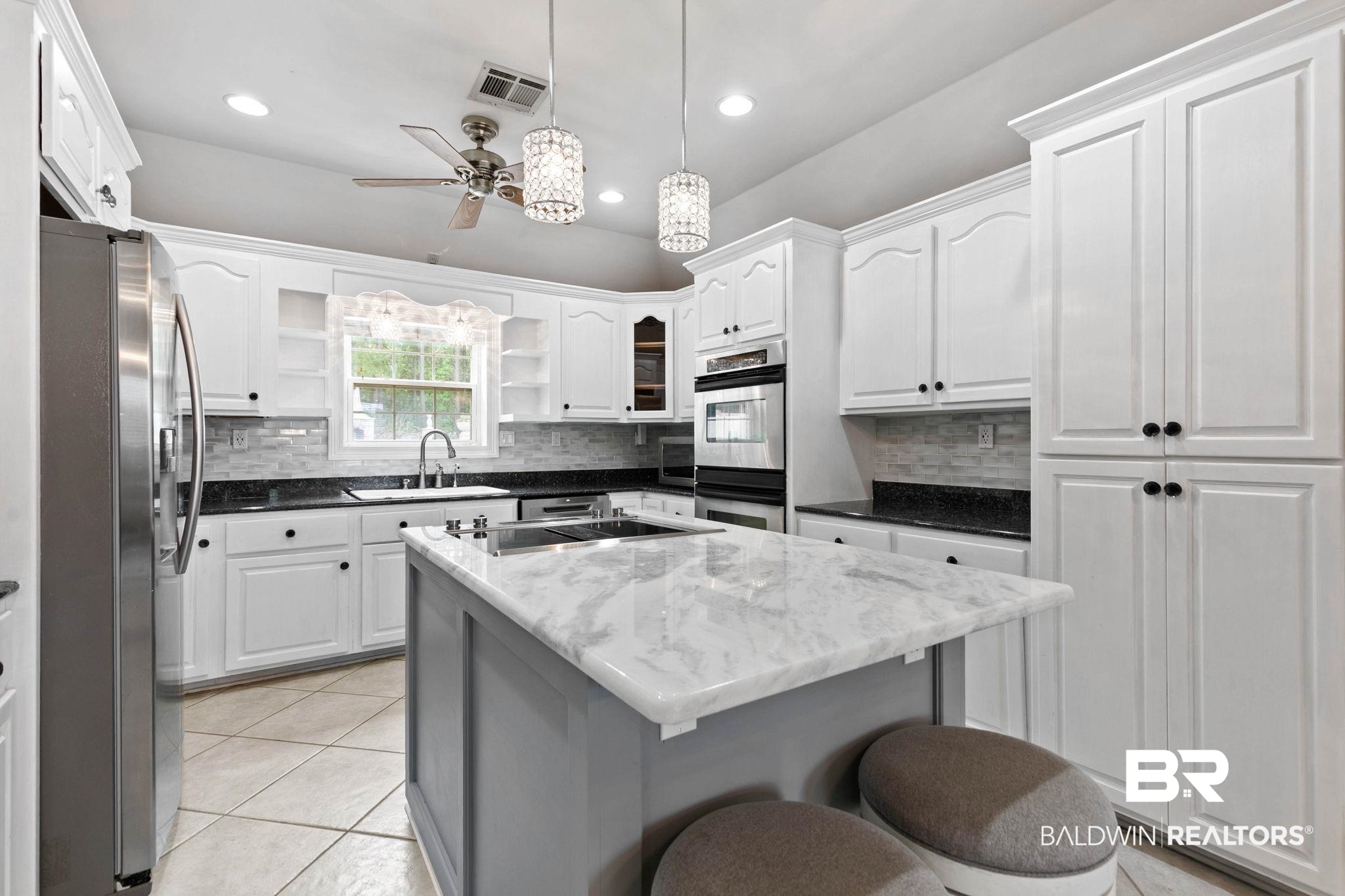 2 Speckle Trout Route Daphne, AL 36527 - Photo 16 of 61 Kitchen with open shelves, stainless steel appliances, dark stone countertops, pendant lighting, and decorative backsplash