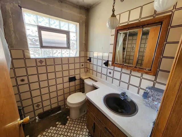 a bathroom with a toilet and a sink