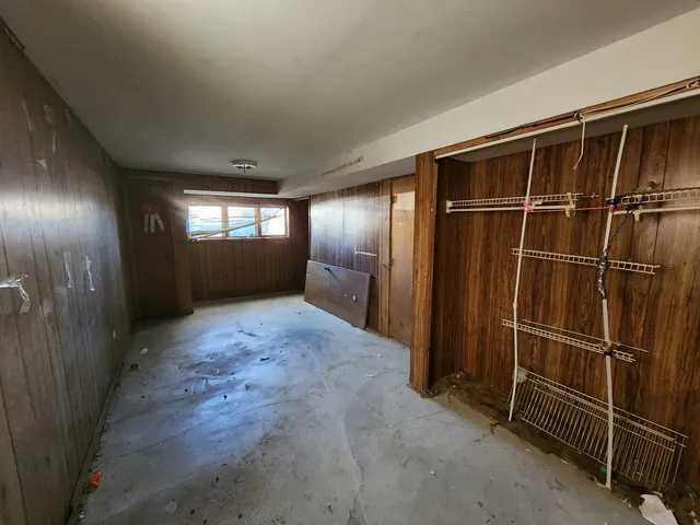 a view of an empty room with windows