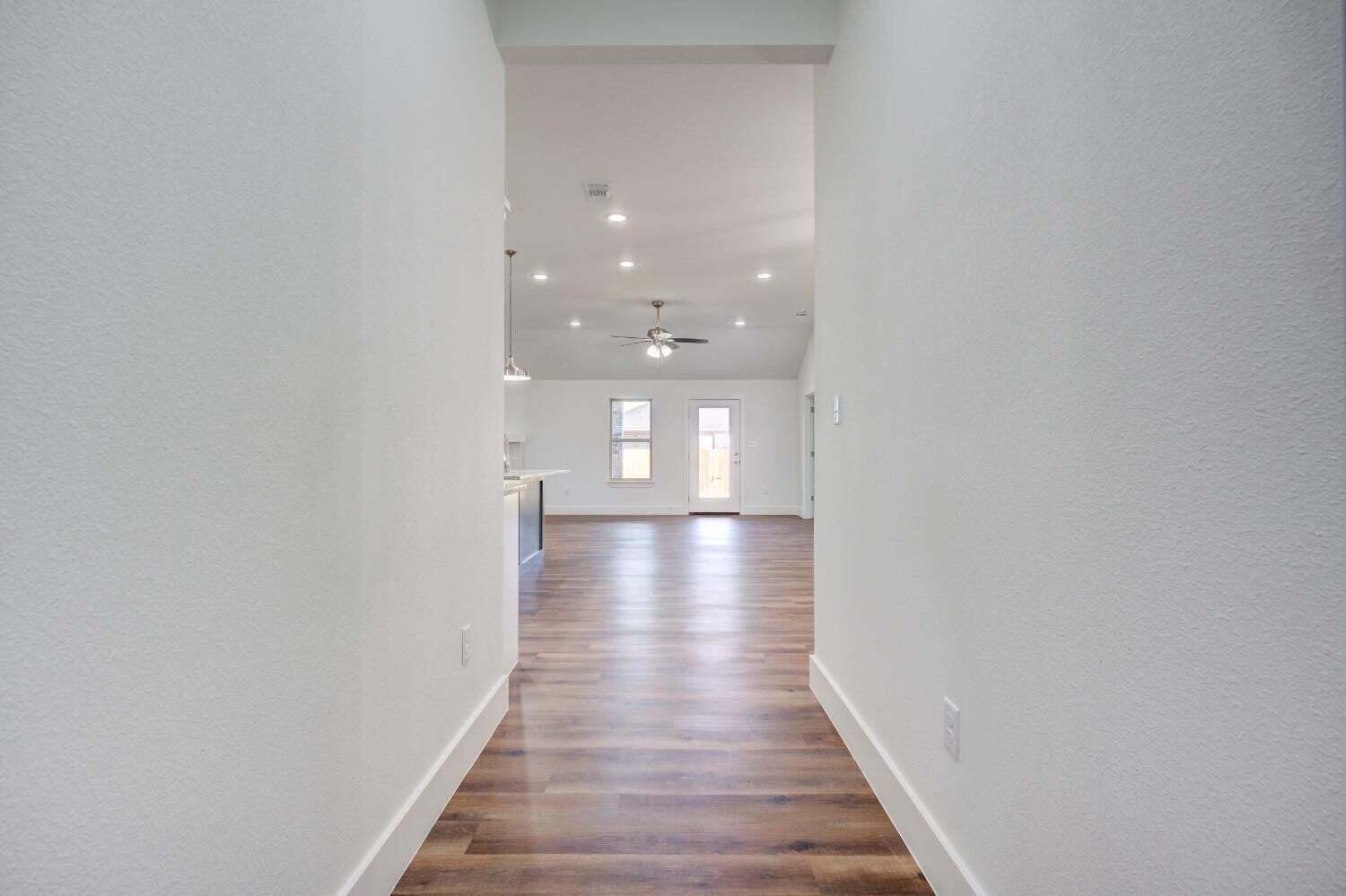 7808 97th Street Lubbock, TX 79424 - Photo 21 of 38 a view of gallery with wooden floor