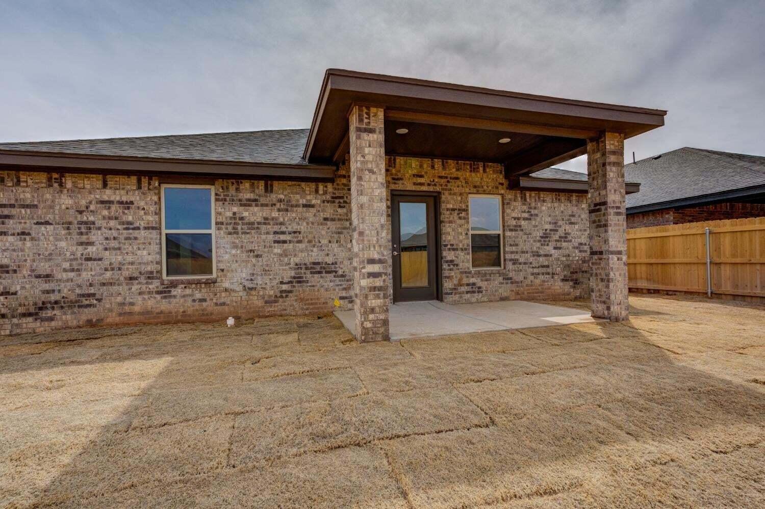 7808 97th Street Lubbock, TX 79424 - Photo 38 of 38 a front view of a house with a yard