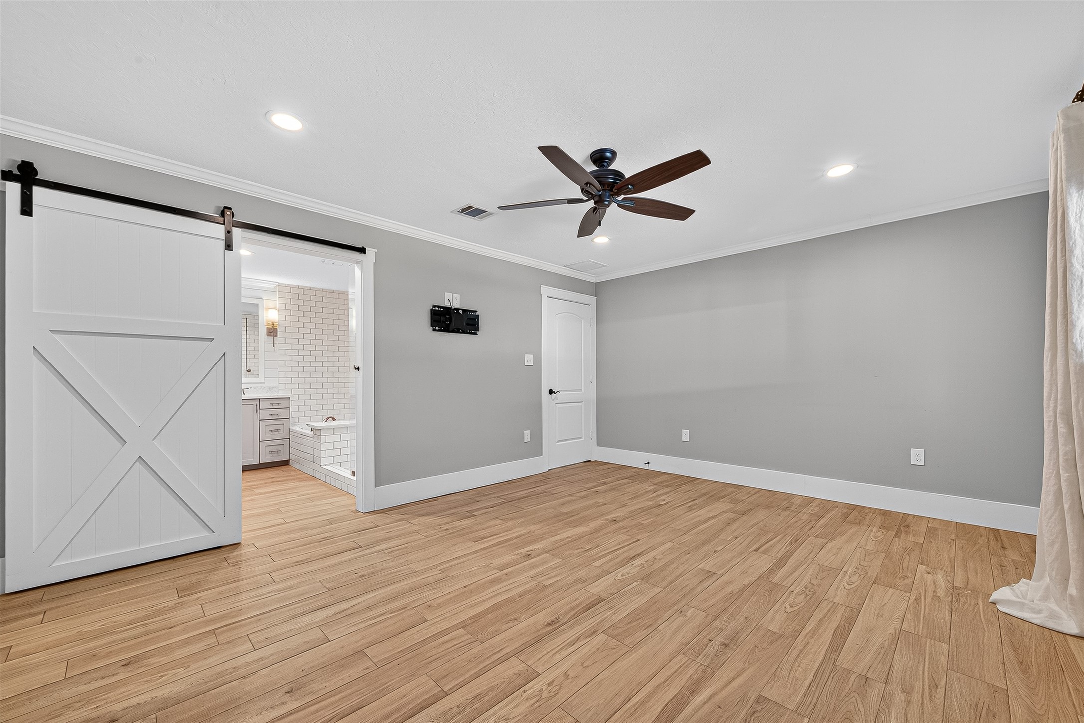 3115 Eula Morgan Road Katy, TX 77493 - Photo 18 of 36 an empty room with wooden floor and windows