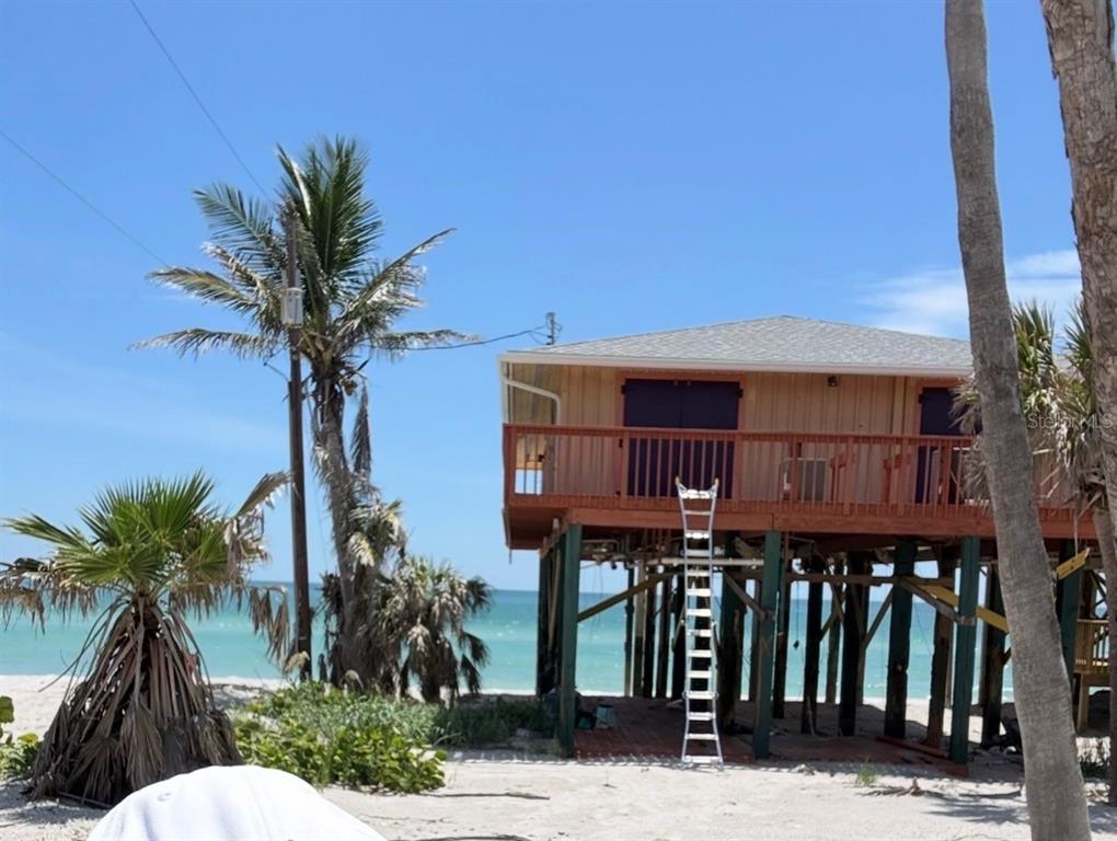 8598 Marsh Street Boca Grande, FL 33921 - Photo 3 of 10 front view of a house with a street