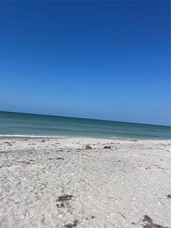 8598 Marsh Street Boca Grande, FL 33921 - Photo 7 of 10 a view of empty room with wooden floor