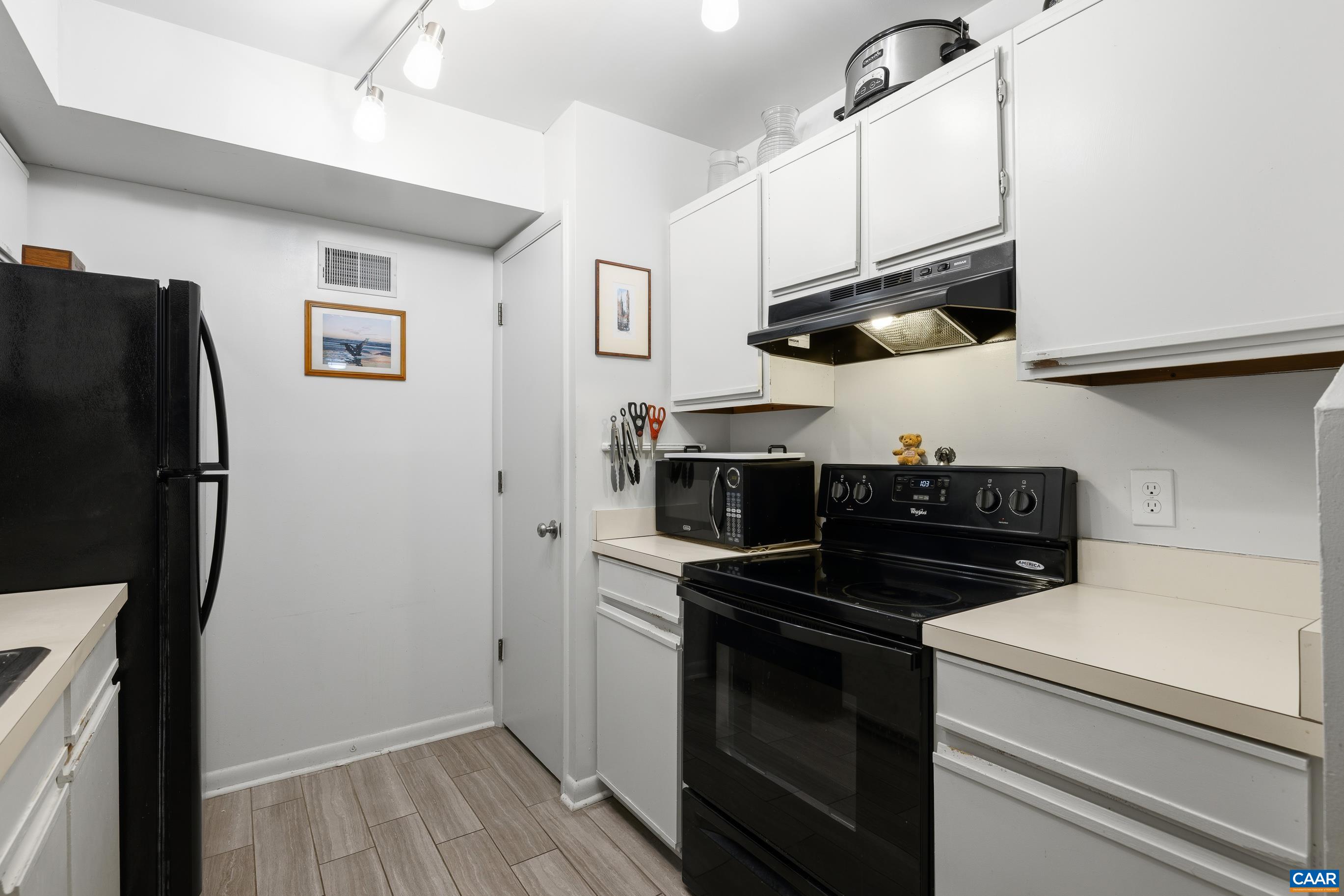 103 Turtle Creek Road, Unit 1 Charlottesville, VA 22901 - Photo 14 of 24 a kitchen with stainless steel appliances a stove and a refrigerator