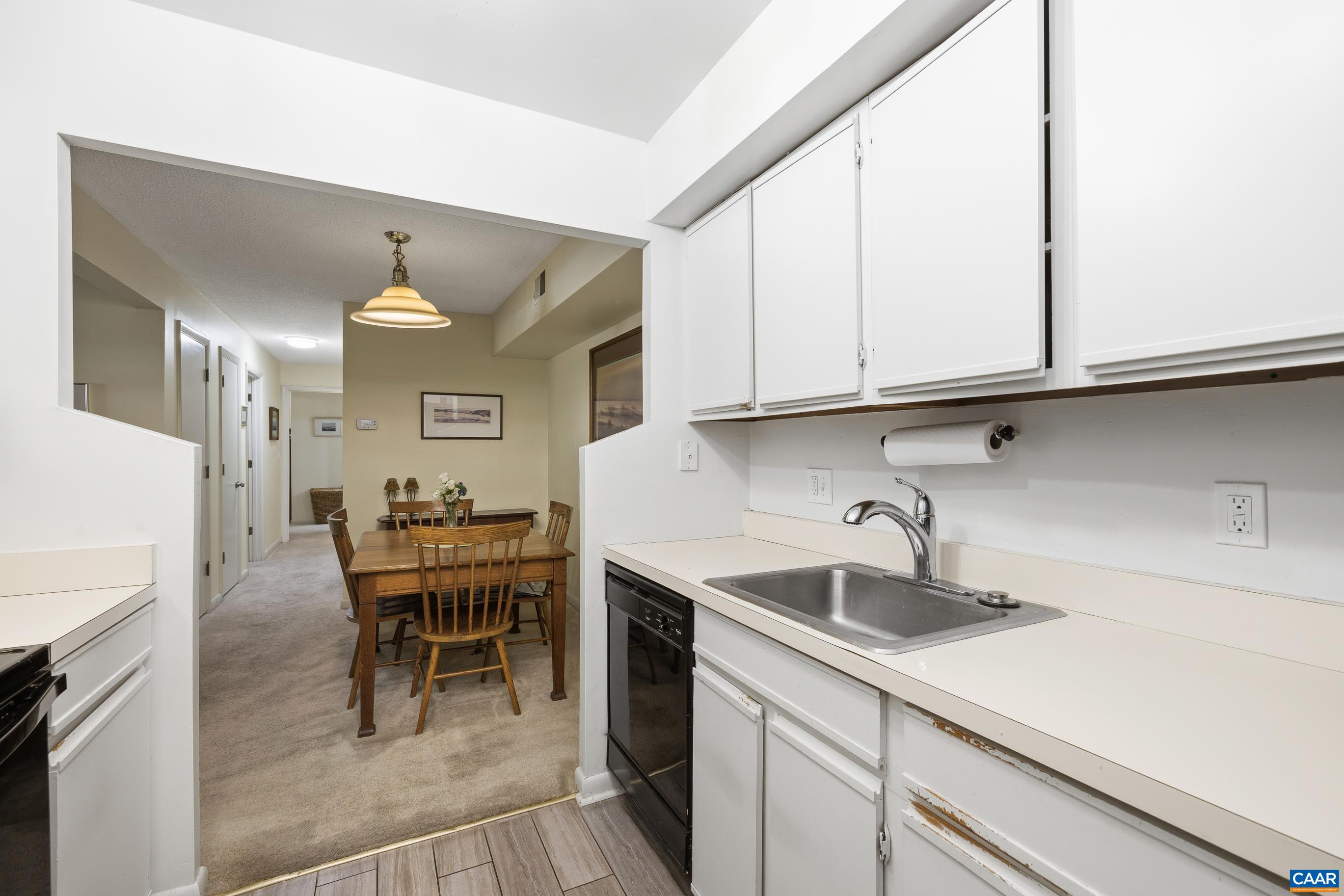 103 Turtle Creek Road, Unit 1 Charlottesville, VA 22901 - Photo 15 of 24 a kitchen with a sink cabinets and wooden floor