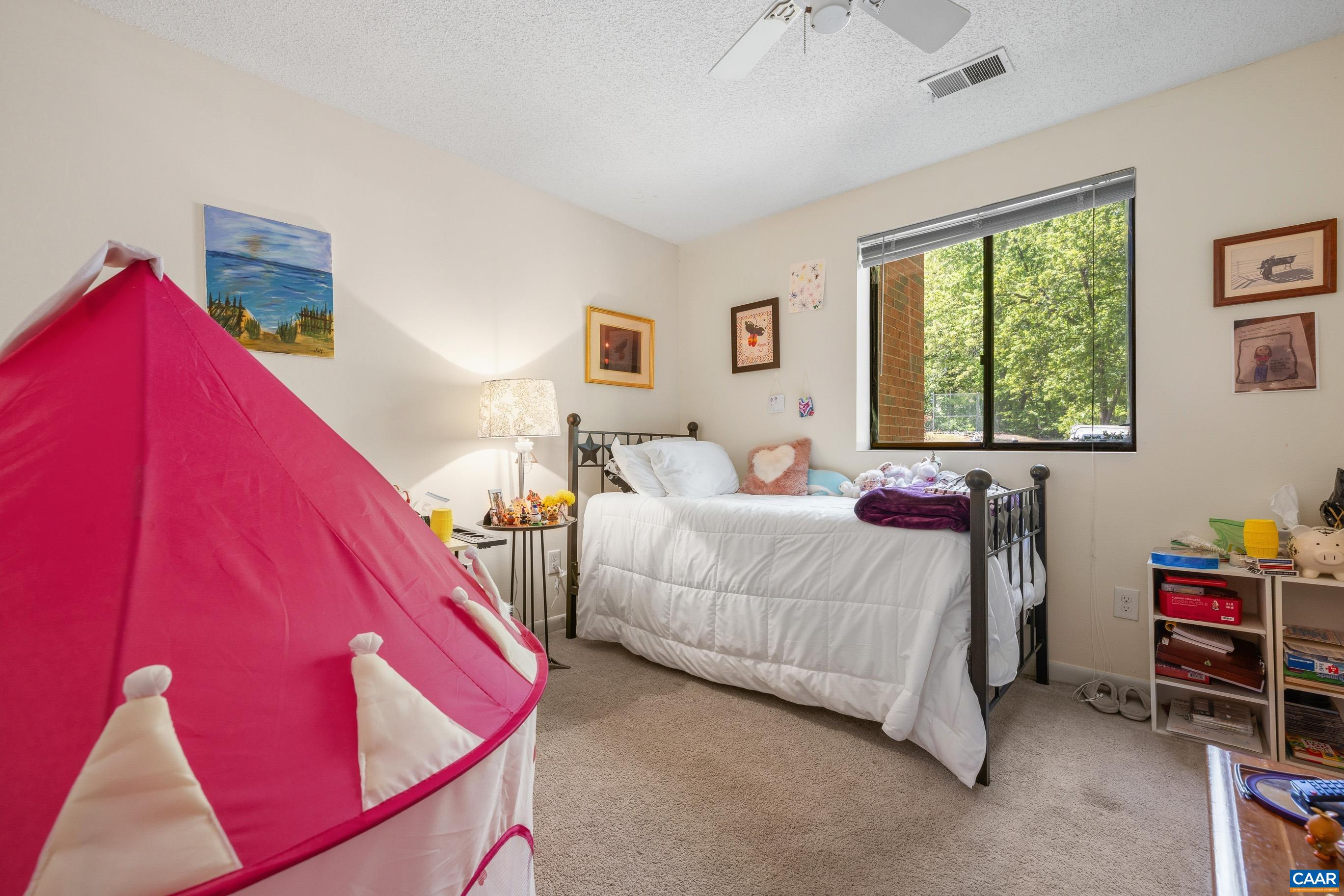 103 Turtle Creek Road, Unit 1 Charlottesville, VA 22901 - Photo 19 of 24 a bedroom with a bed and a window