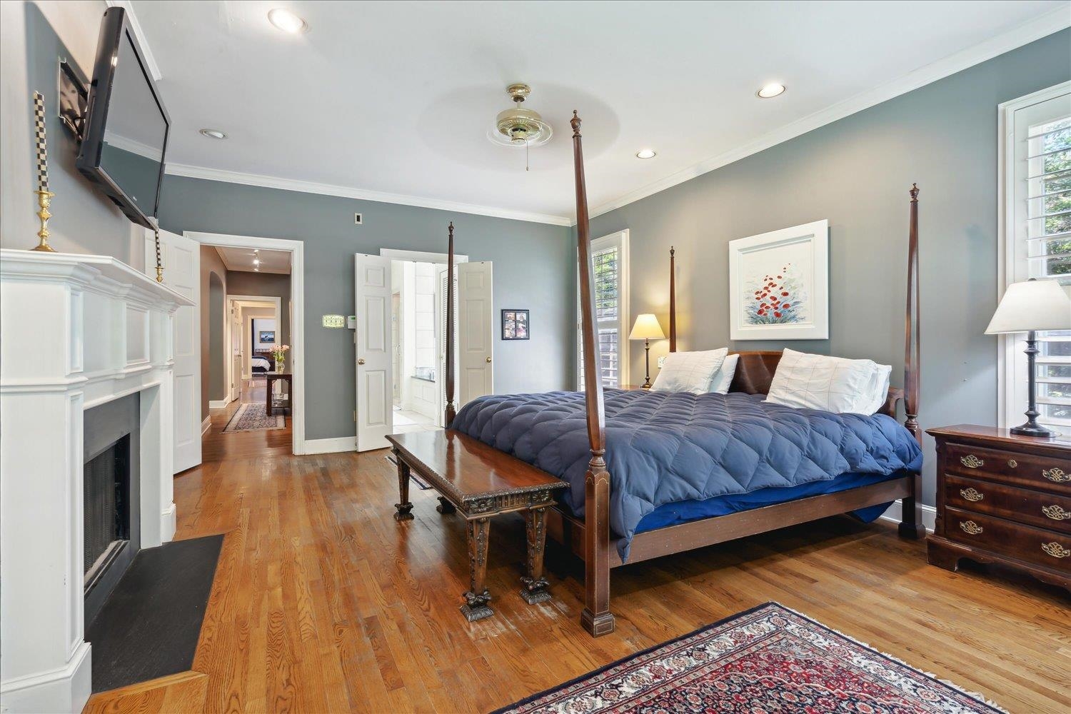 24 South Rose Road Memphis, TN 38117 - Photo 20 of 40 a bedroom with a bed dresser and a fireplace