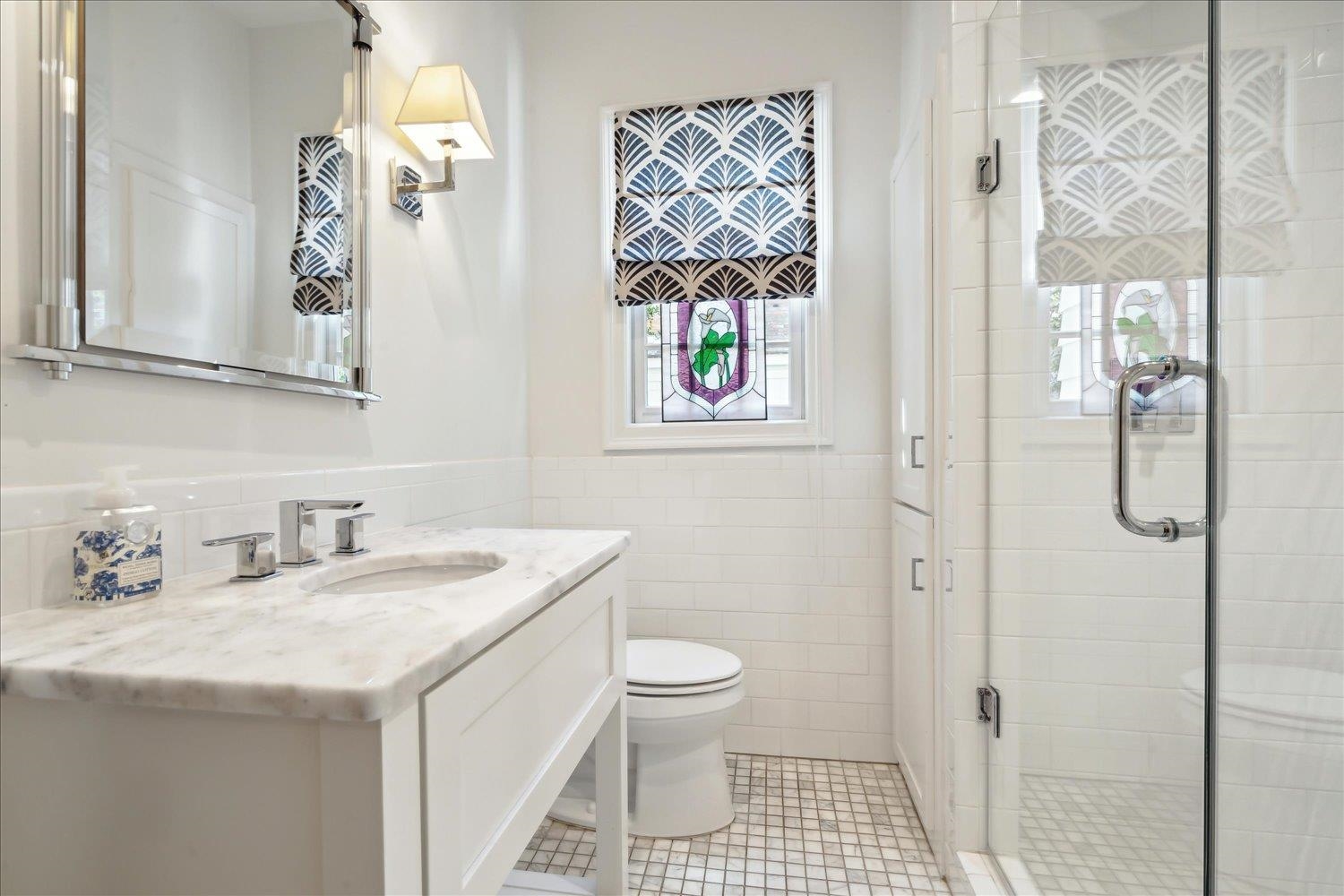 24 South Rose Road Memphis, TN 38117 - Photo 30 of 40 a bathroom with a sink a toilet and a shower