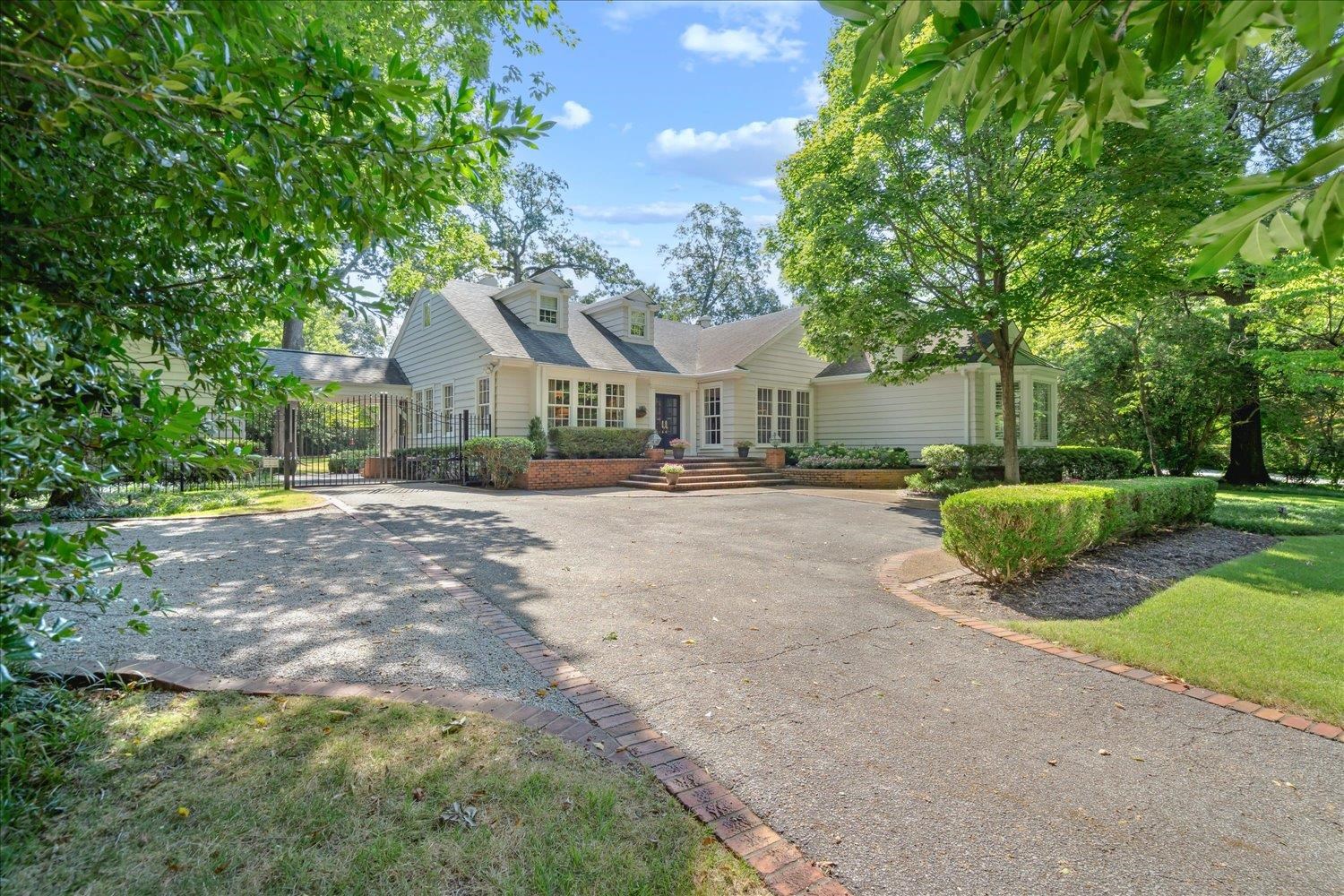 24 South Rose Road Memphis, TN 38117 - Photo 5 of 40 a view of road with house and trees in the background