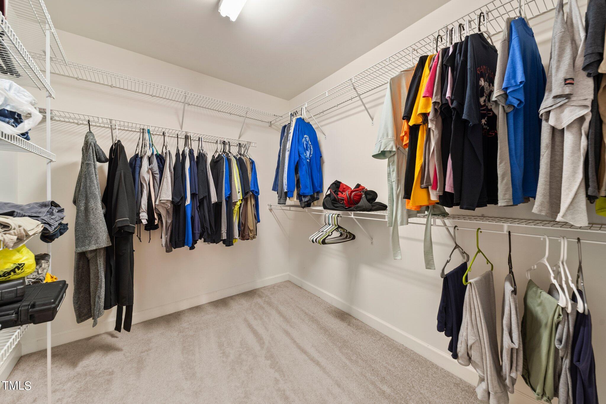 2461 Farrell Road Mebane, NC 27302 - Photo 14 of 35 a view of walk in closet with clothes and shoes