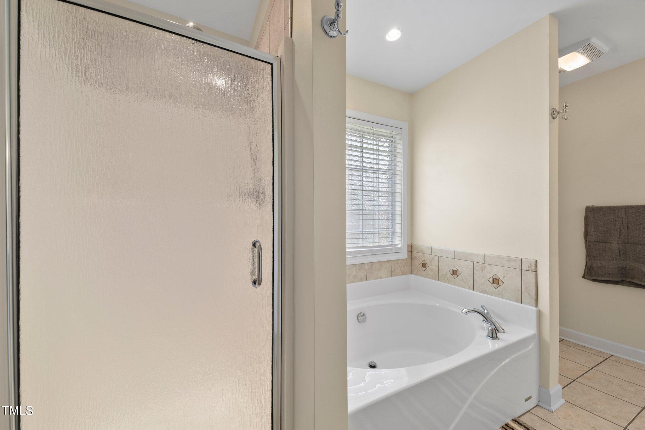 2461 Farrell Road Mebane, NC 27302 - Photo 16 of 35 a bathroom with a tub and shower