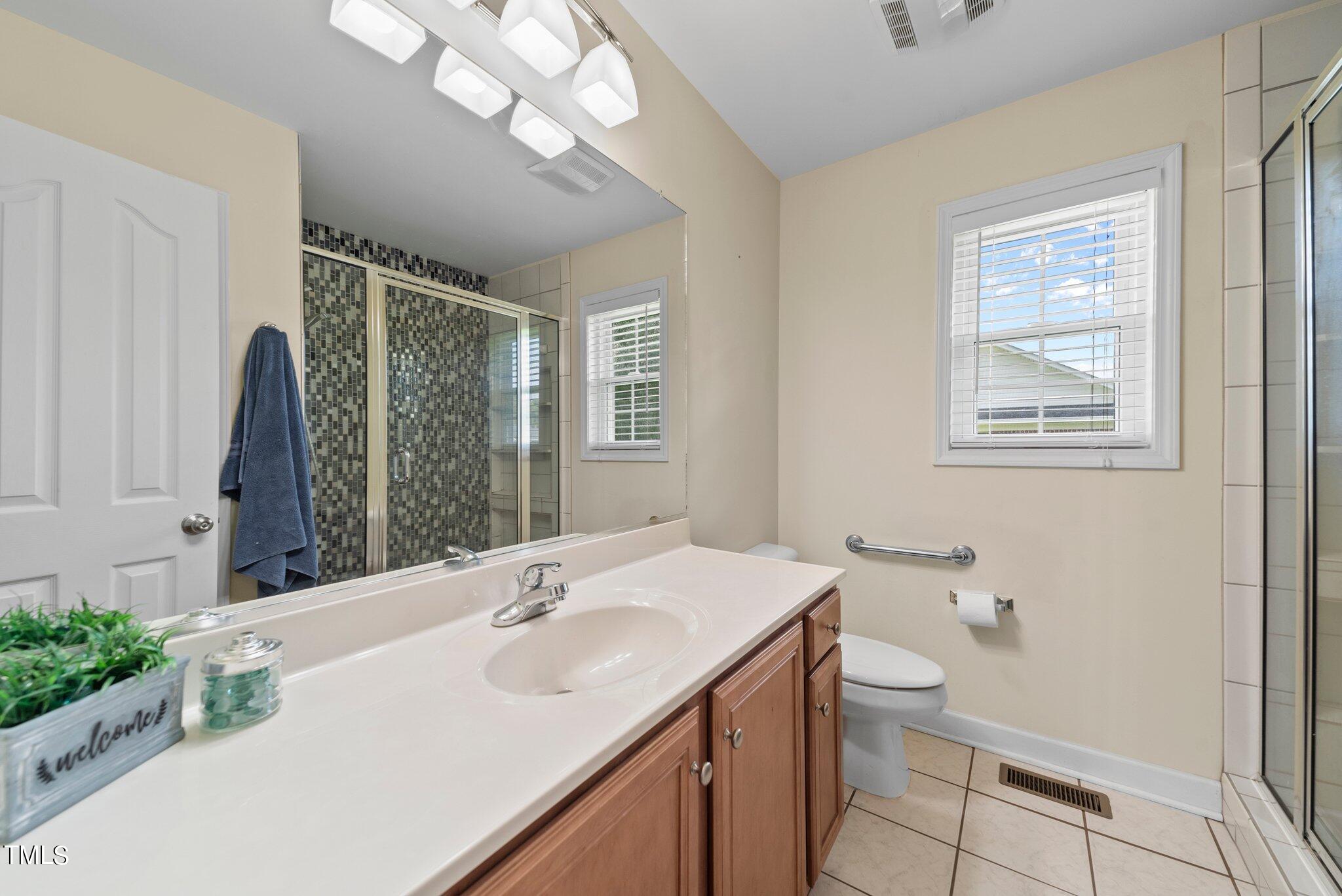2461 Farrell Road Mebane, NC 27302 - Photo 22 of 35 a bathroom with a sink vanity granite and toilet