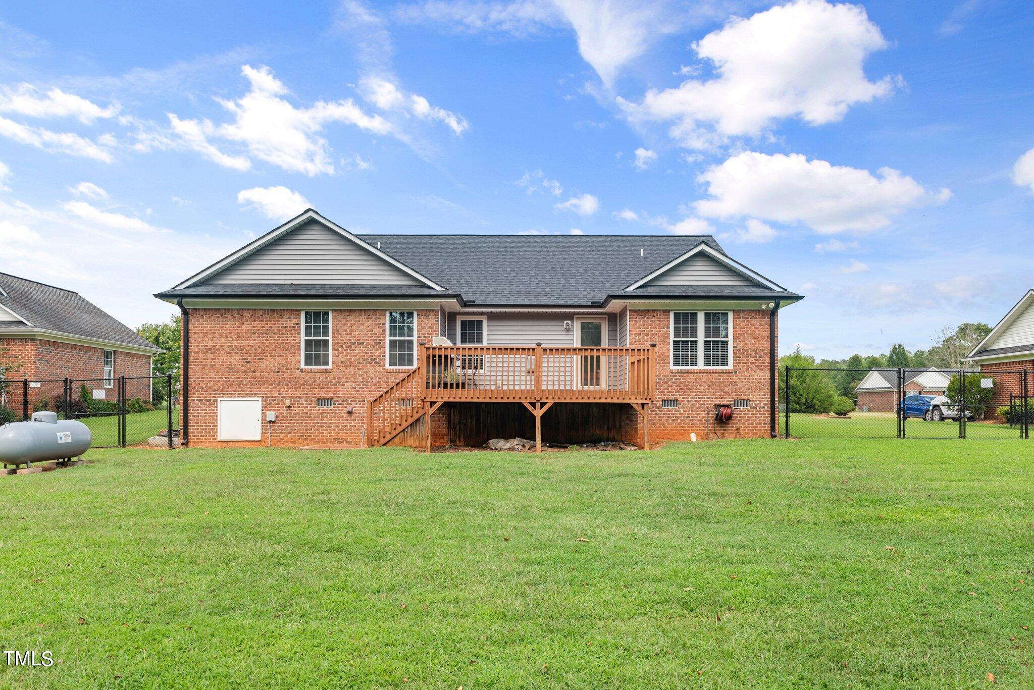 2461 Farrell Road Mebane, NC 27302 - Photo 23 of 35 a view of a house with a yard and sitting area