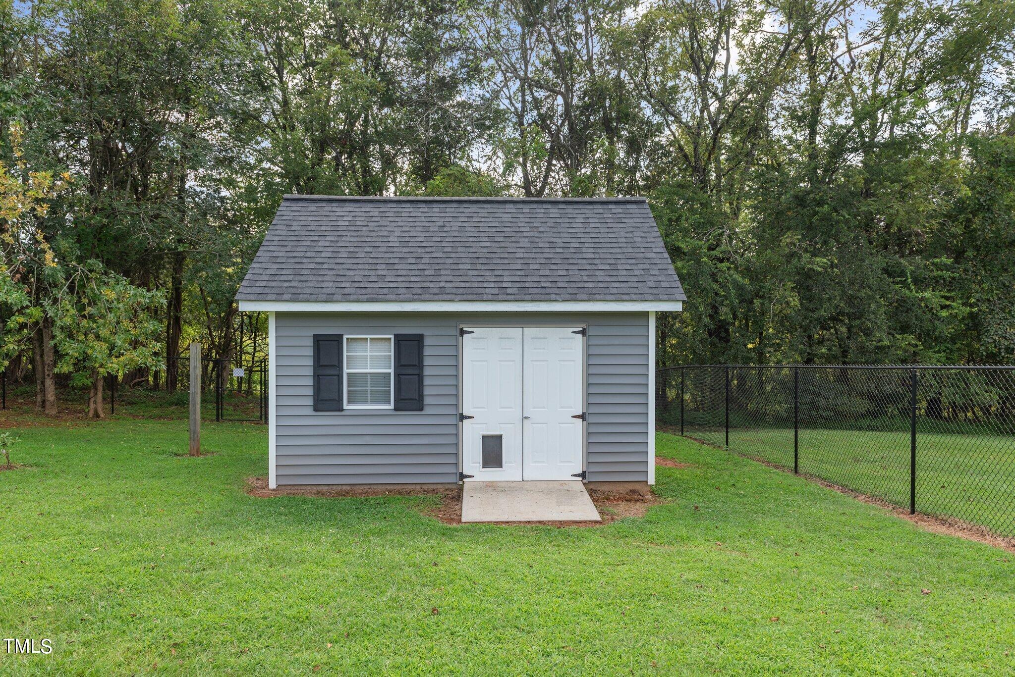 2461 Farrell Road Mebane, NC 27302 - Photo 25 of 35 a view of a house with a backyard