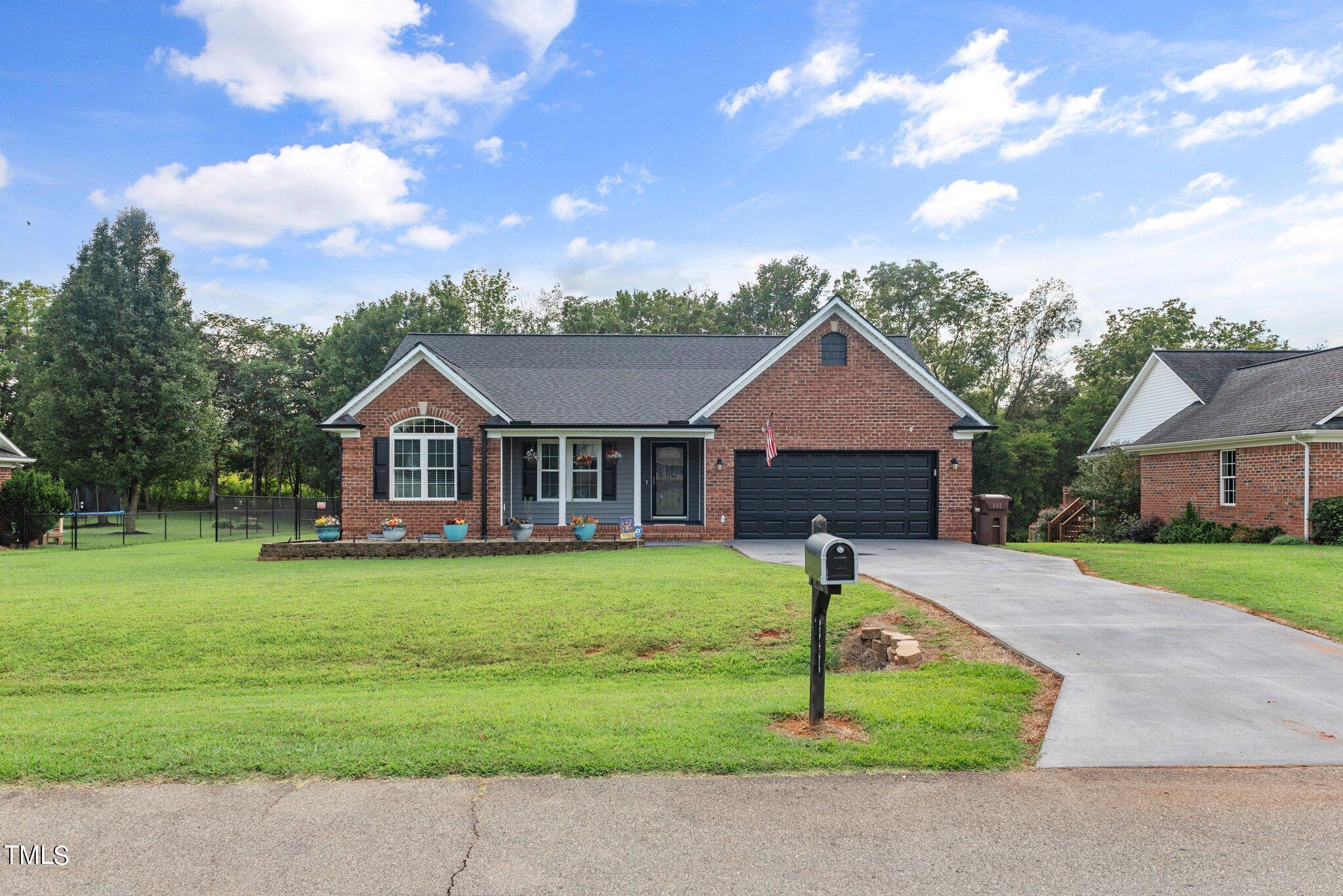 2461 Farrell Road Mebane, NC 27302 - Photo 30 of 35 a front view of a house with garden
