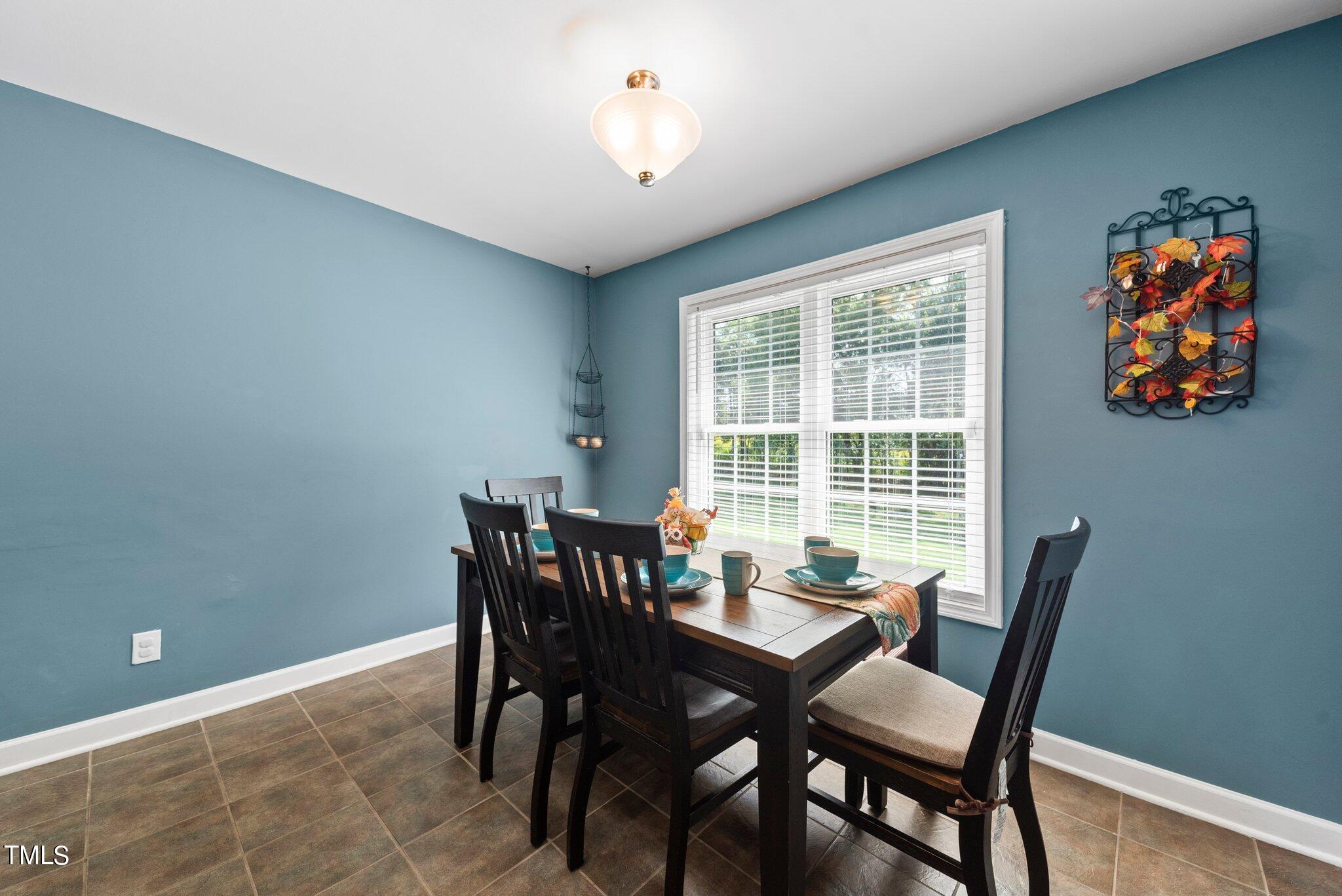 2461 Farrell Road Mebane, NC 27302 - Photo 6 of 35 a view of a dining room with furniture window and outside view