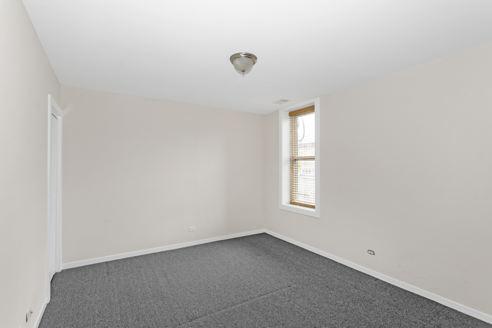 1333 West Taylor Street, Unit 2 Chicago, IL 60607 - Photo 15 of 22 an empty room with windows and closet