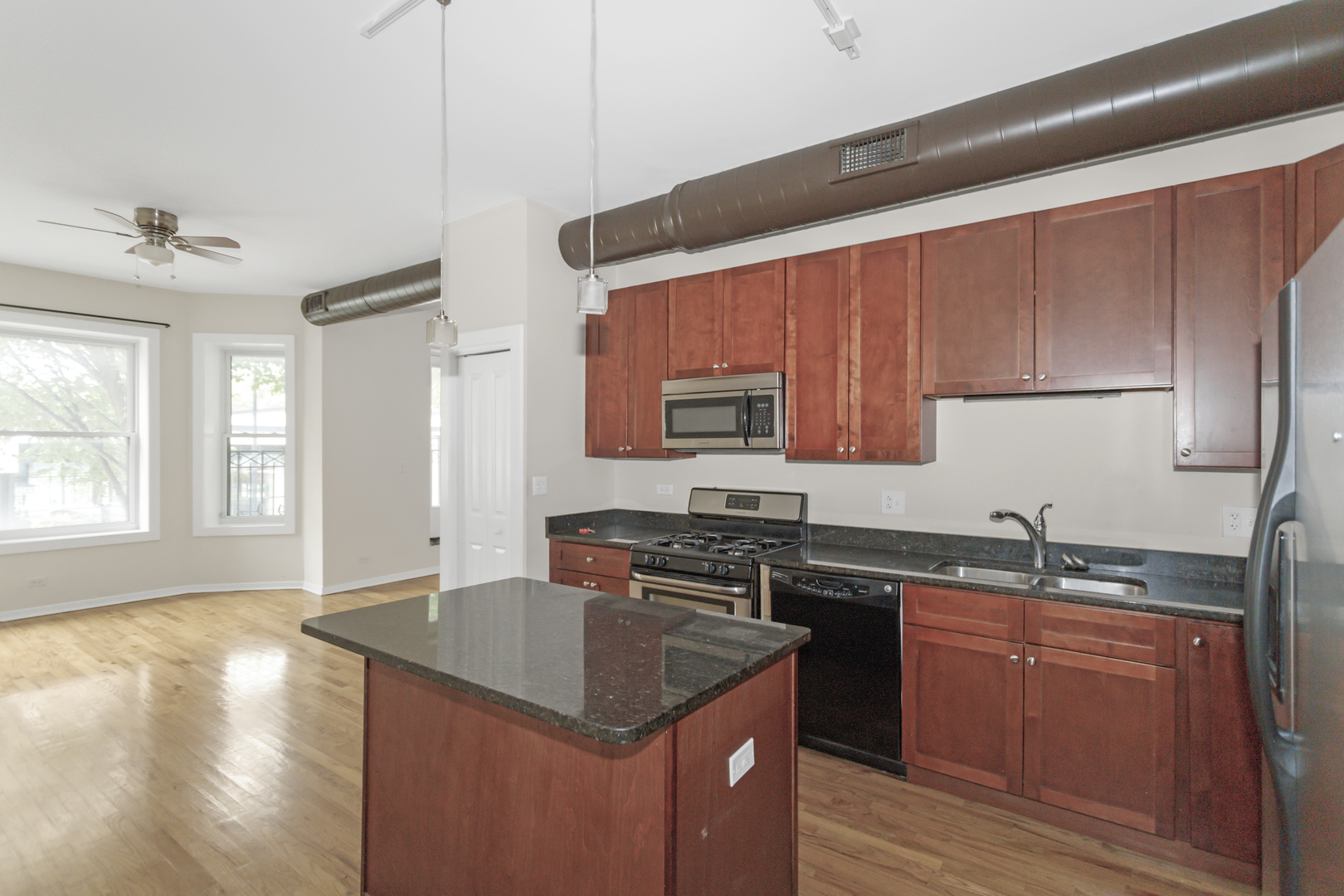 1333 West Taylor Street, Unit 2 Chicago, IL 60607 - Photo 7 of 22 a kitchen with a sink stove top oven and cabinets