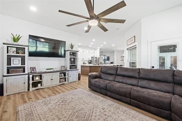 a large kitchen with a table and chairs