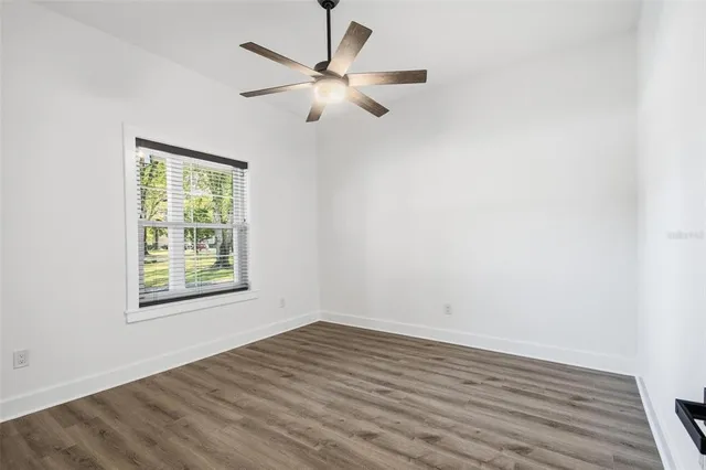 a bedroom with a bed and a potted plant