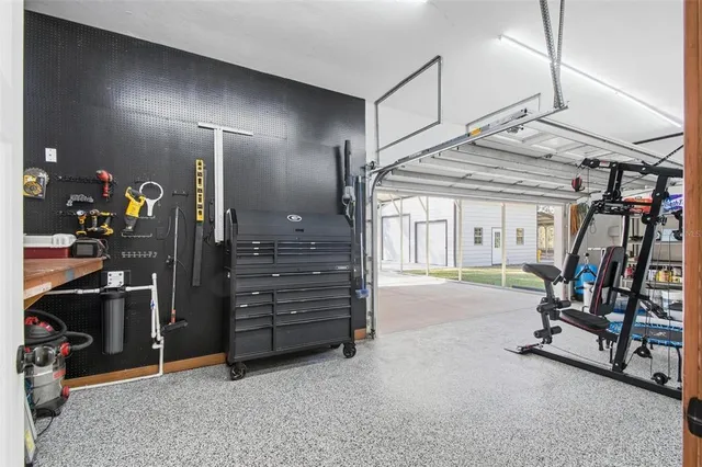 a view of a patio with dining table and chairs