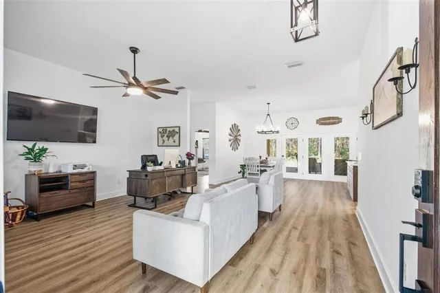 a living room with furniture window and wooden floor