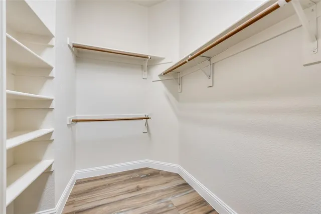 a view of an empty walk in closet