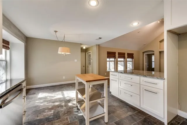 a room with a table and chairs