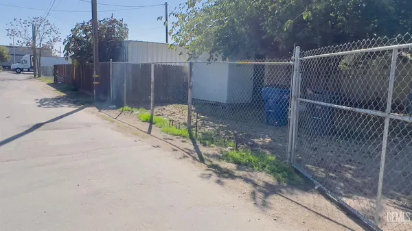 a view of small space with wooden fence