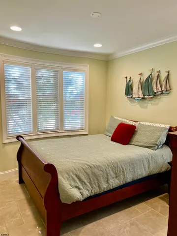 a bedroom with a bed and dresser