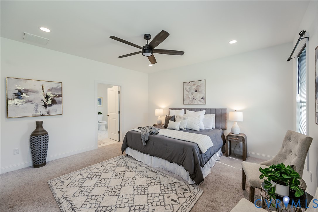 720 Chapman Street Ashland, VA 23005 - Photo 29 of 50 a bedroom with a bed and ceiling fan