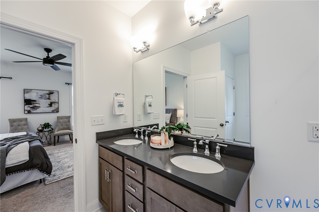 720 Chapman Street Ashland, VA 23005 - Photo 33 of 50 a bathroom with double vanity sinks and a mirror