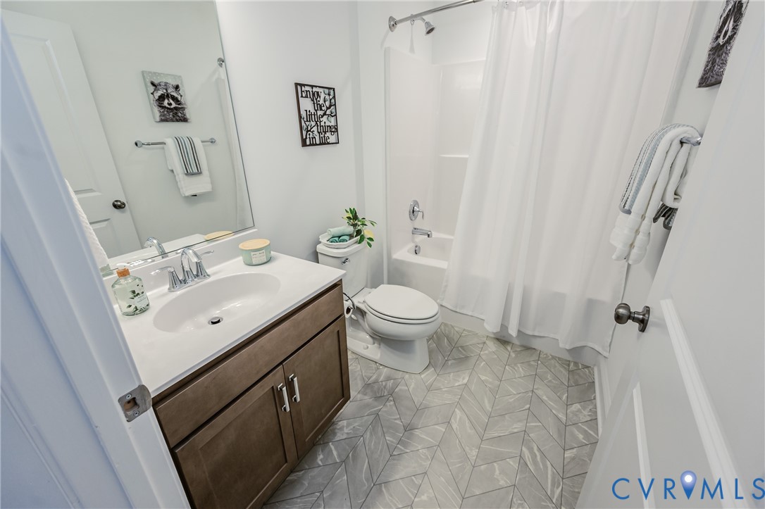 720 Chapman Street Ashland, VA 23005 - Photo 38 of 50 a bathroom with a sink toilet and shower