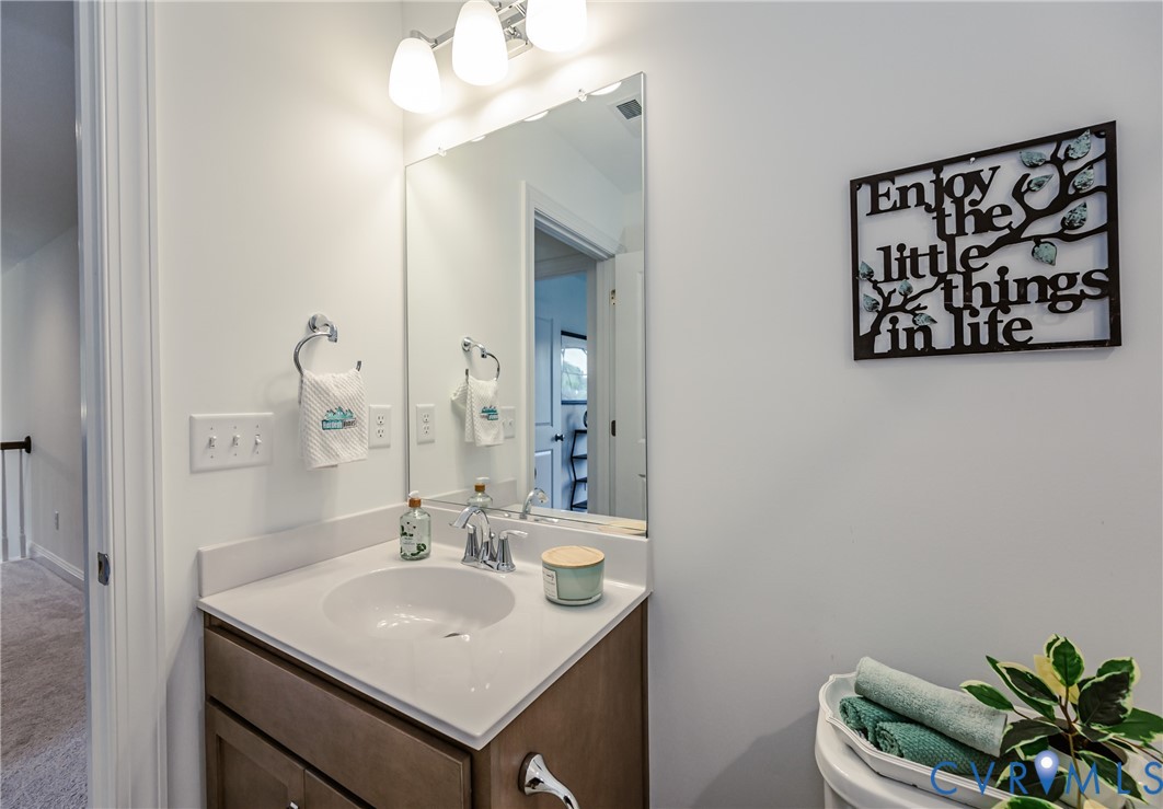 720 Chapman Street Ashland, VA 23005 - Photo 39 of 50 a bathroom with a sink vanity and a mirror
