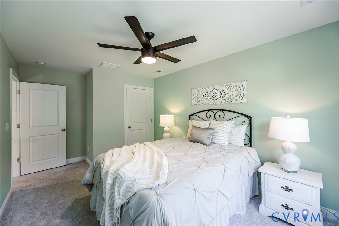 720 Chapman Street Ashland, VA 23005 - Photo 46 of 50 a bedroom with a bed and a lamp