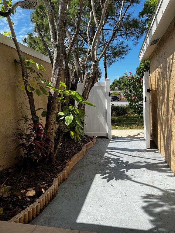 835 East Gulf Boulevard, Unit 101 Indian Rocks Beach, FL 33785 - Photo 11 of 21 a view of a back yard of the house
