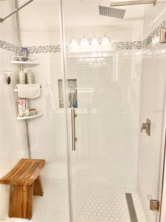 835 East Gulf Boulevard, Unit 101 Indian Rocks Beach, FL 33785 - Photo 12 of 21 a bathroom with a shower