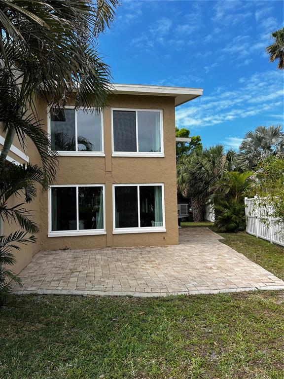 835 East Gulf Boulevard, Unit 101 Indian Rocks Beach, FL 33785 - Photo 4 of 21 a view of house with yard