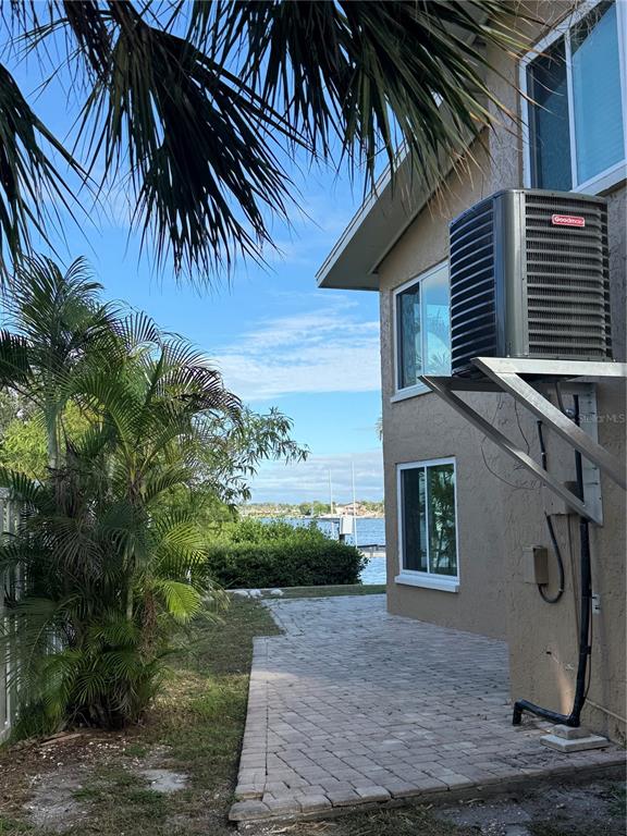 835 East Gulf Boulevard, Unit 101 Indian Rocks Beach, FL 33785 - Photo 5 of 21 a front view of a house with a yard