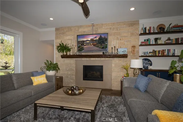 a living room with furniture and a fireplace