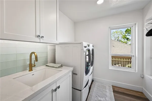 a bathroom with a sink a toilet and a window
