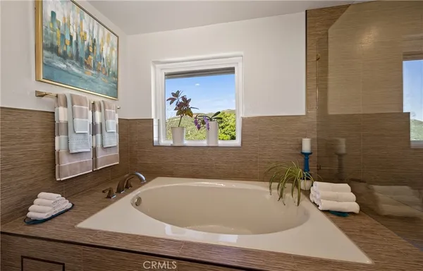 a bathroom with a tub and sink