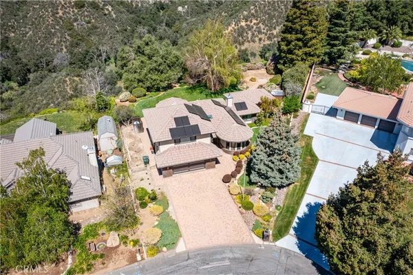 an aerial view of a house with outdoor space